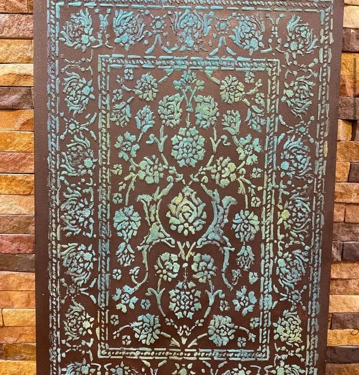Detail of a hand-carved wooden panel